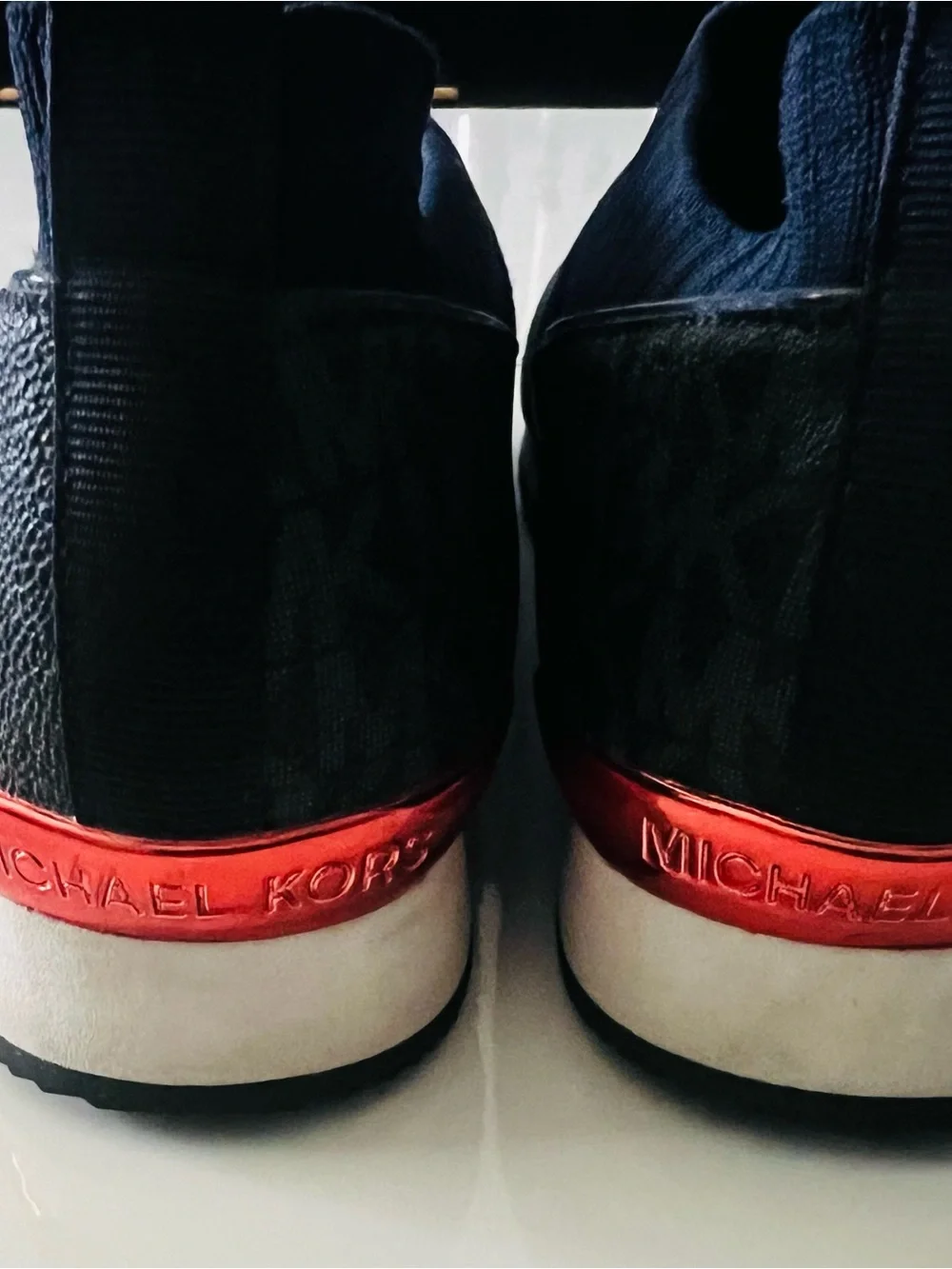 Michael Kors Women’s Blue Slip-On Sneakers with Red Logo Band